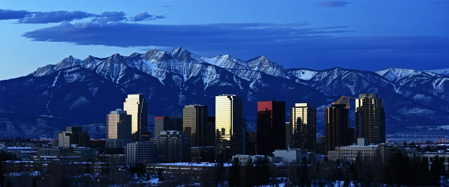 Denver Colorado skyline with Rocky Mountains in the background — Terraxiq headquarters